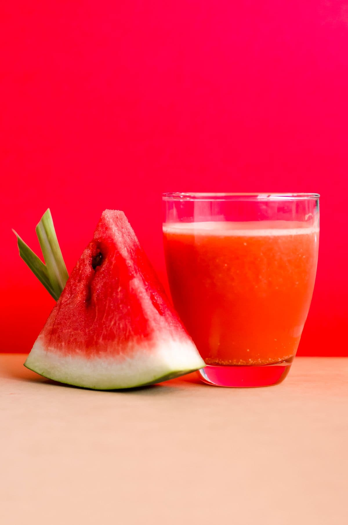 Watermelon juice with a fresh watermelon slice
