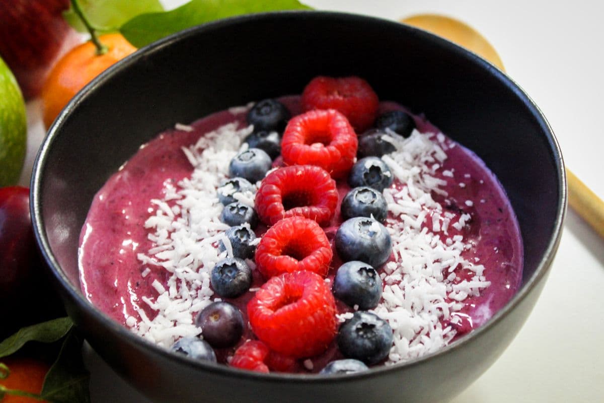 Acai bowl with raspberries, blueberries and coconut